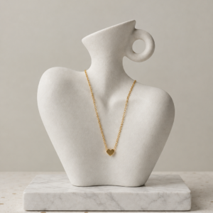 Gold tone heart pendant necklace in stainless steel by Nagina Jewellery
