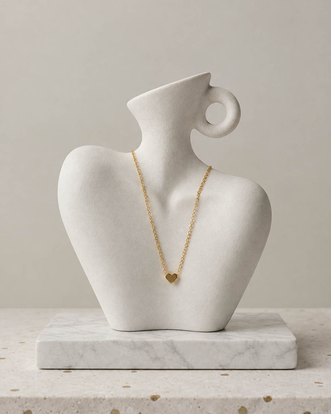 Gold tone heart pendant necklace in stainless steel by Nagina Jewellery